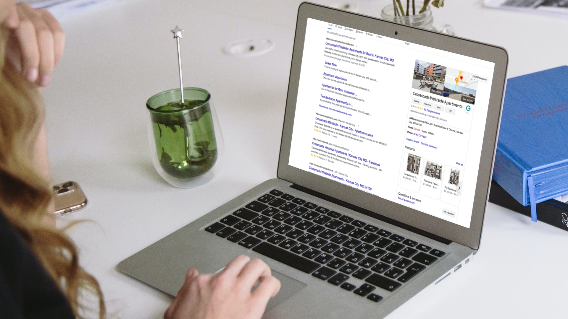 Woman using MacBook Air on the desk-20-Crossroads-Westside-Apartments-Kansas-City-MO-Google-Business-Profile.png